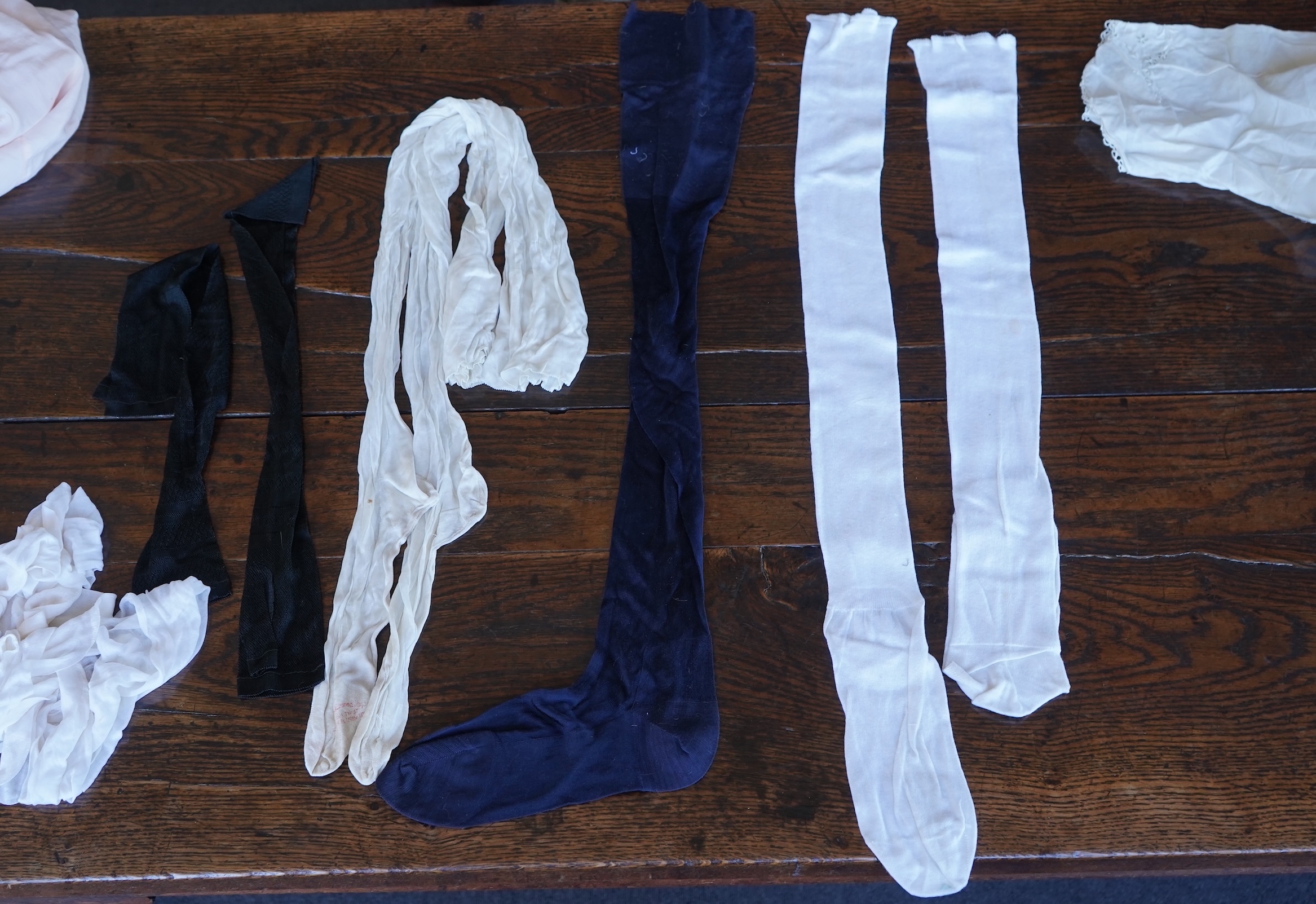 A collection of 1920's-30's silk and satin camisole slips, two cream silk and lace jackets, a lace blouse a silk embroidered blouse, a silk cami, and a collection of silk stockings., Condition- good